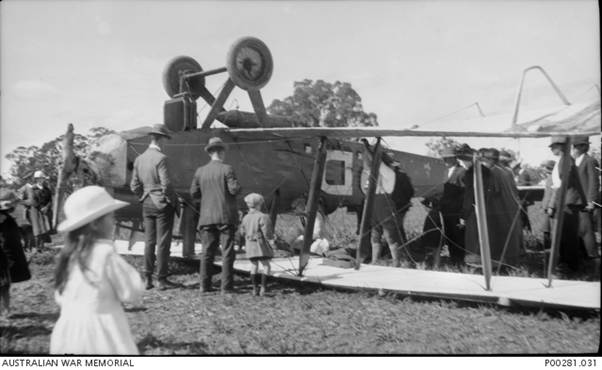Ray Parer The Airco DH9 near Culcairn, NSW mid 1920 following a landing mishap in fading light on a rough freshly cultivated paddock. It was then transported by rail to Melbourne England to Australia Air Race
