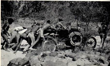 A group of people on a dirt road

Description automatically generated